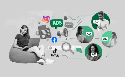 An illustration of a marketer at a computer with floating digital ads—like banners, search ads, and social media icons—reaching people on phones and laptops, with a world map in the background showing global reach and growth.